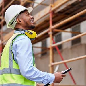 Architecture, inspection and checklist with contractor on construction site