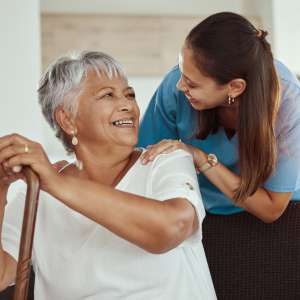 Support professional healthcare worker helping elderly lady or patient.