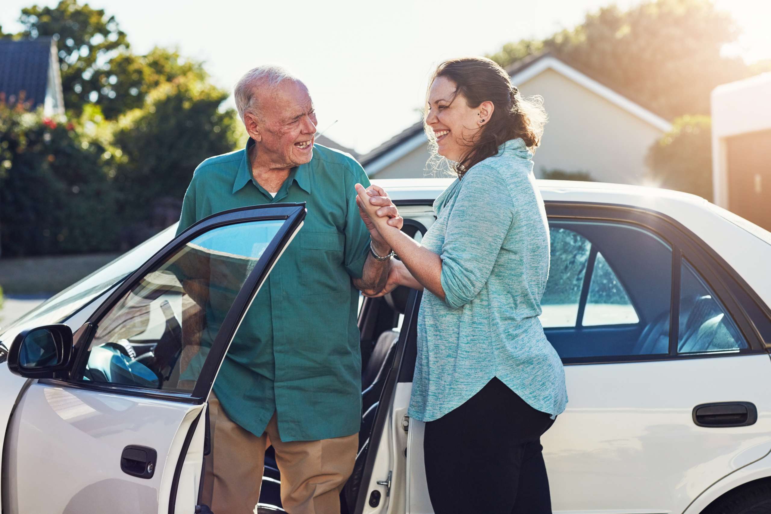 Caregiver woman with old man for assisted living.