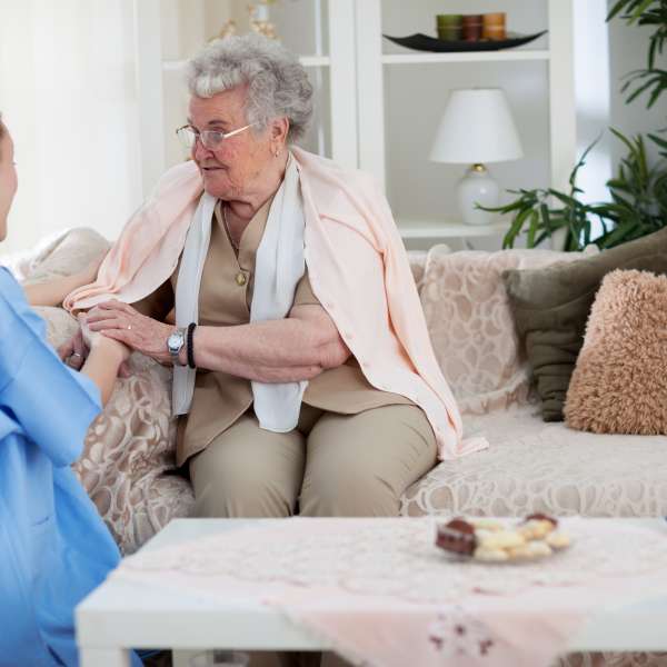 Nurse talking with an old woman