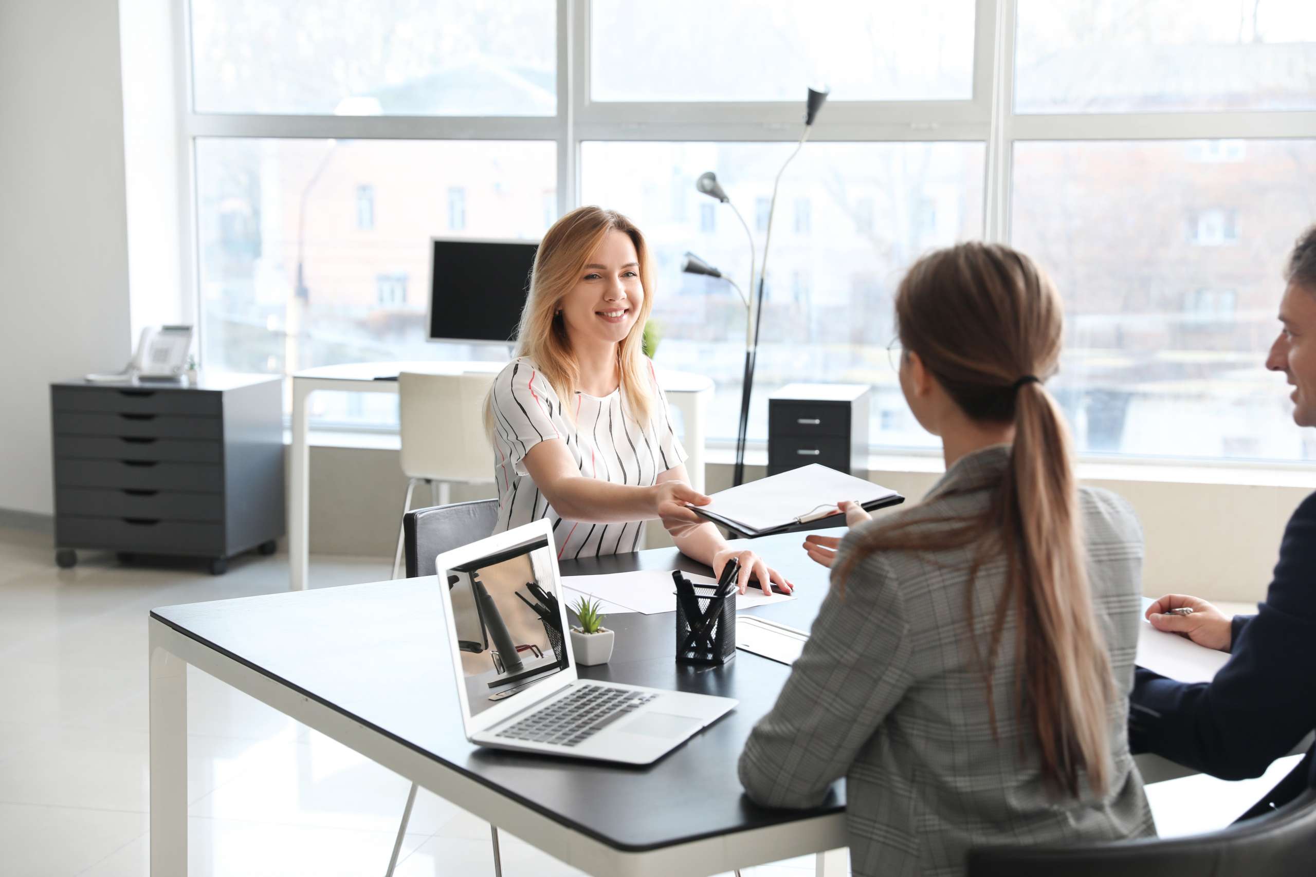 Human resources officer interviewing woman in office