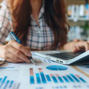 Business owner doing finances and calculating financial report