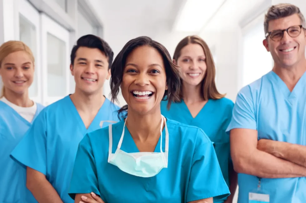 Female and male nurse practitioners looking straight