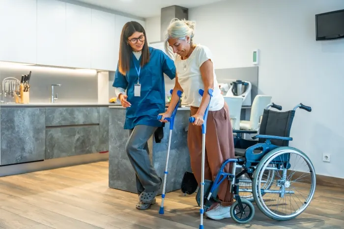 A home care worker assisting a senior person at a home care agency