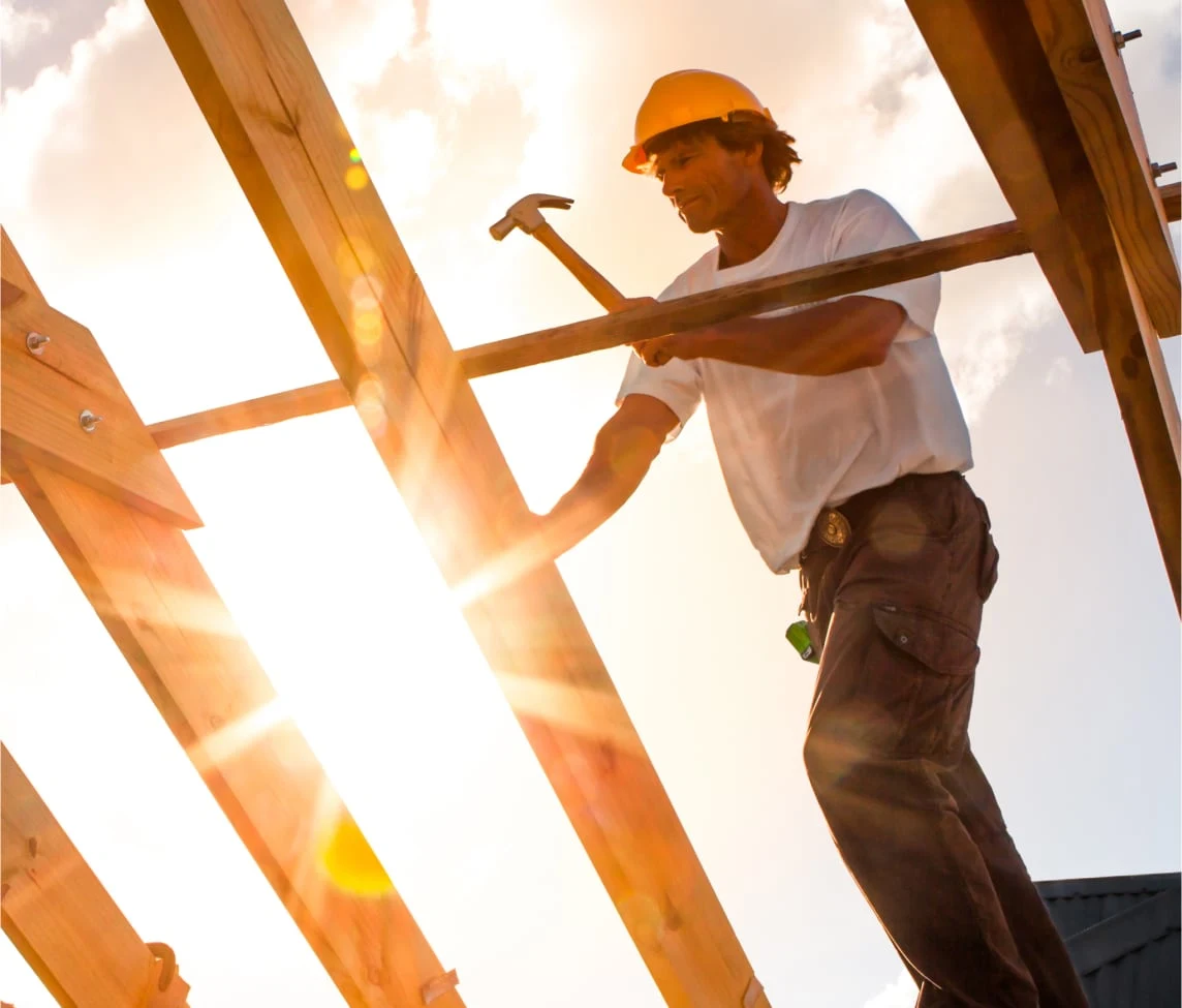 carpenter working on a roof