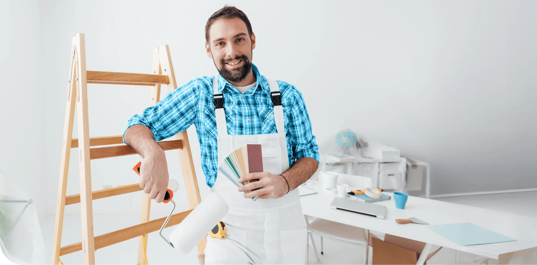 Painter at a jobsite with colour samples in his hand