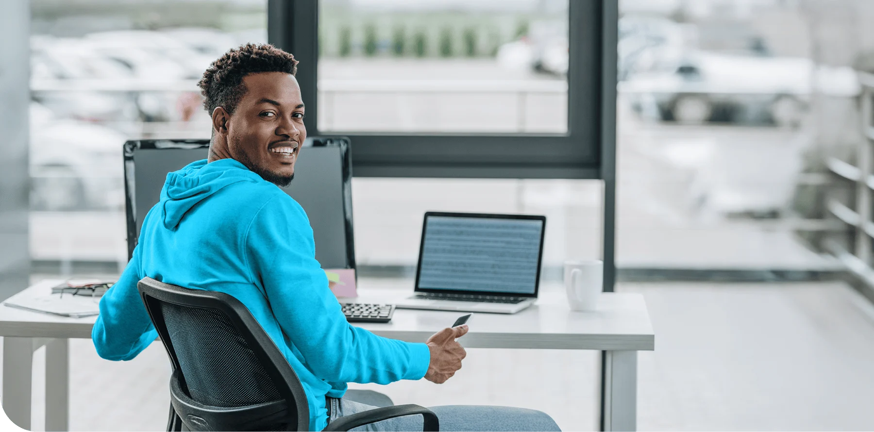 Software Developer at work in front of a laptop